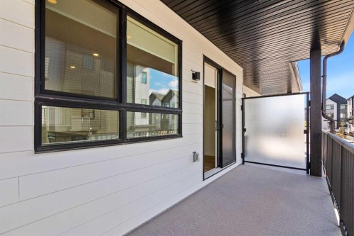 132 Quesnay Wood Link Sw, Calgary, AB - Outdoor With Balcony With Exterior