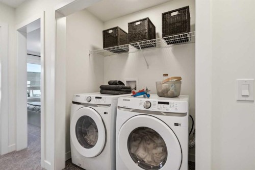 132 Quesnay Wood Link Sw, Calgary, AB - Indoor Photo Showing Laundry Room