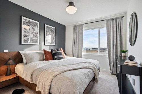 132 Quesnay Wood Link Sw, Calgary, AB - Indoor Photo Showing Bedroom