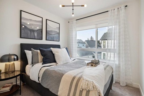 132 Quesnay Wood Link Sw, Calgary, AB - Indoor Photo Showing Bedroom