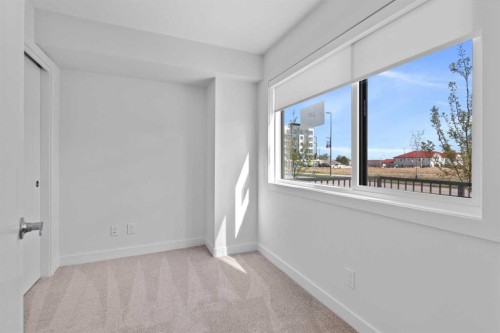 132 Quesnay Wood Link Sw, Calgary, AB - Indoor Photo Showing Other Room