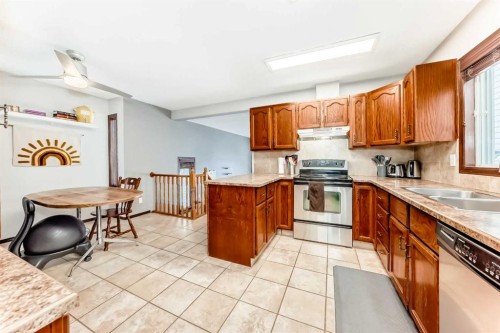 219 Sandstone Drive Nw, Calgary, AB - Indoor Photo Showing Kitchen With Double Sink