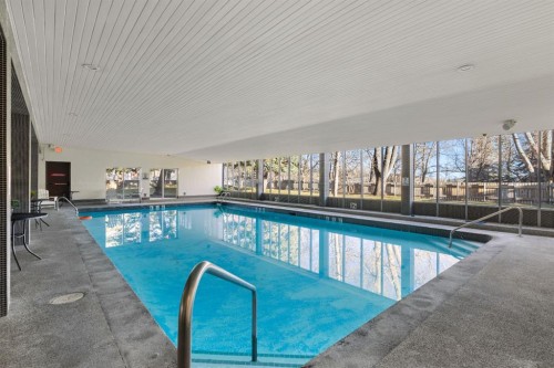 704-4944 Dalton Drive Nw, Calgary, AB -  Photo Showing Other Room With In Ground Pool