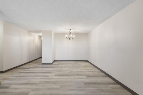 704-4944 Dalton Drive Nw, Calgary, AB - Indoor Photo Showing Other Room