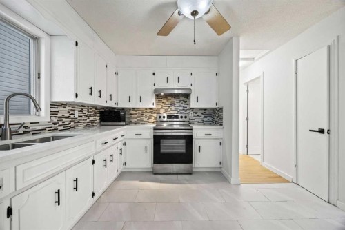 212 Falmere Way Ne, Calgary, AB - Indoor Photo Showing Kitchen With Double Sink With Upgraded Kitchen