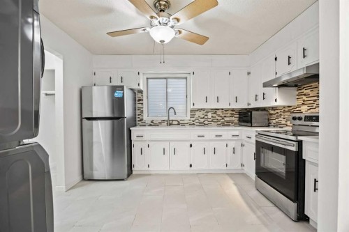 212 Falmere Way Ne, Calgary, AB - Indoor Photo Showing Kitchen With Stainless Steel Kitchen With Double Sink