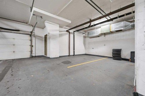 708-108 15 Avenue Se, Calgary, AB - Indoor Photo Showing Garage