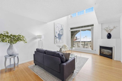 708-108 15 Avenue Se, Calgary, AB - Indoor Photo Showing Living Room With Fireplace