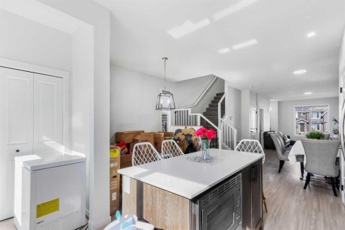 15 Edith Passage Nw, Calgary, AB - Indoor Photo Showing Dining Room