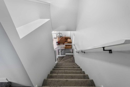 15 Edith Passage Nw, Calgary, AB - Indoor Photo Showing Other Room