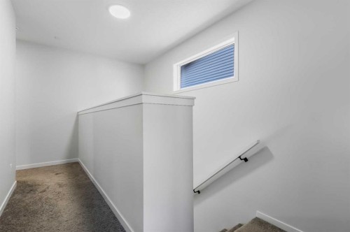 15 Edith Passage Nw, Calgary, AB - Indoor Photo Showing Other Room