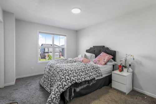 15 Edith Passage Nw, Calgary, AB - Indoor Photo Showing Bedroom