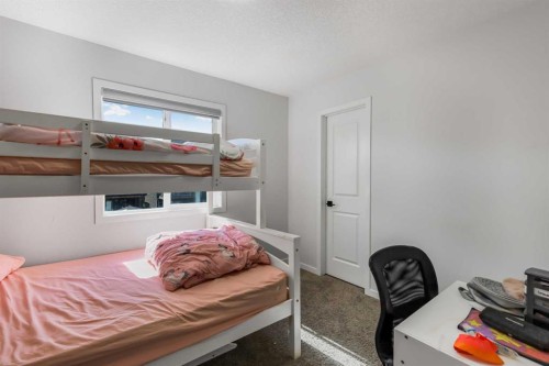 15 Edith Passage Nw, Calgary, AB - Indoor Photo Showing Bedroom