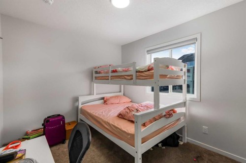 15 Edith Passage Nw, Calgary, AB - Indoor Photo Showing Bedroom