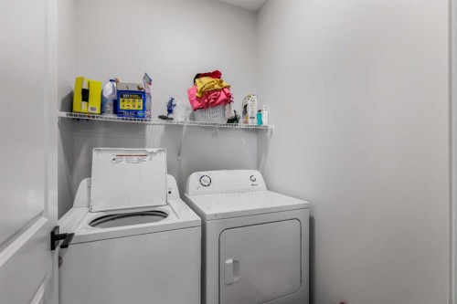 15 Edith Passage Nw, Calgary, AB - Indoor Photo Showing Laundry Room
