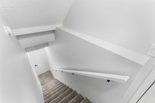 15 Edith Passage Nw, Calgary, AB - Indoor Photo Showing Other Room