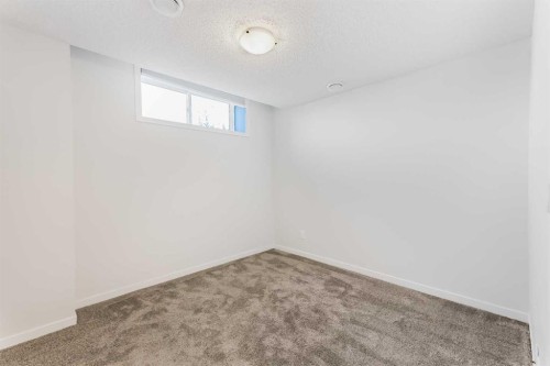 15 Edith Passage Nw, Calgary, AB - Indoor Photo Showing Other Room