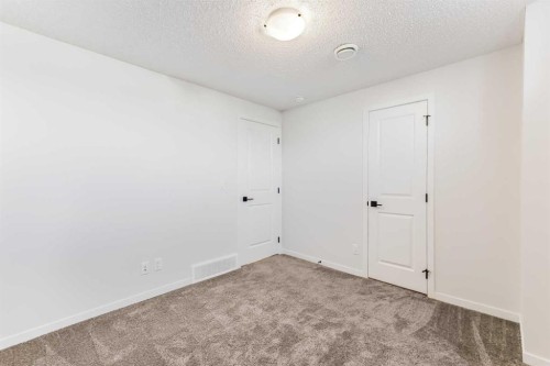 15 Edith Passage Nw, Calgary, AB - Indoor Photo Showing Other Room