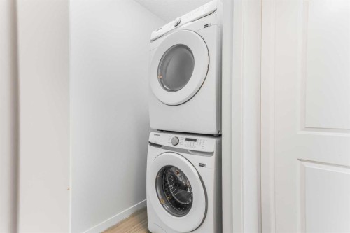 15 Edith Passage Nw, Calgary, AB - Indoor Photo Showing Laundry Room