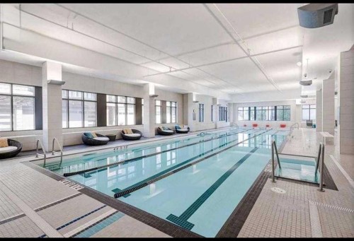 403-122 Mahogany Centre Se, Calgary, AB - Indoor Photo Showing Other Room With In Ground Pool