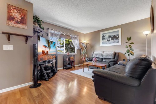 120 Pennsburg Way Se, Calgary, AB - Indoor Photo Showing Living Room
