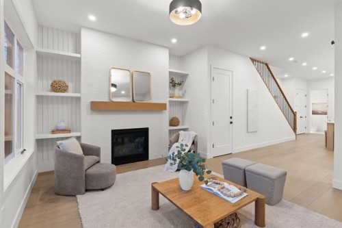 610 24A Street Nw, Calgary, AB - Indoor Photo Showing Living Room With Fireplace