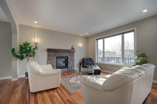 1796 Panatella Boulevard Nw, Calgary, AB - Indoor Photo Showing Living Room With Fireplace