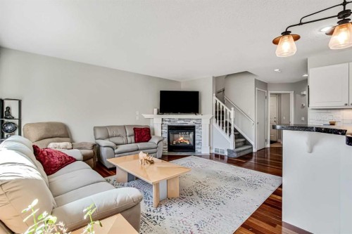 189 Coral Springs Court Ne, Calgary, AB - Indoor Photo Showing Living Room With Fireplace