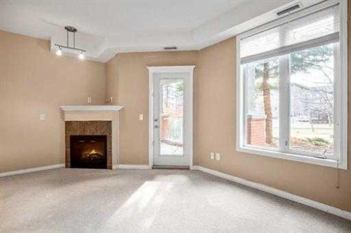 108-15 Everstone Drive Sw, Calgary, AB - Indoor With Fireplace