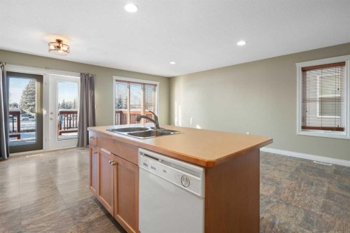 17 Deer Coulee Drive, Didsbury, AB - Indoor Photo Showing Kitchen With Double Sink