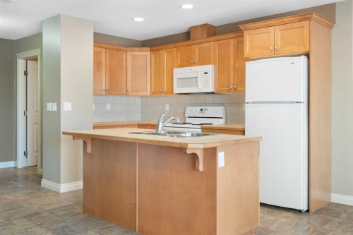 17 Deer Coulee Drive, Didsbury, AB - Indoor Photo Showing Kitchen