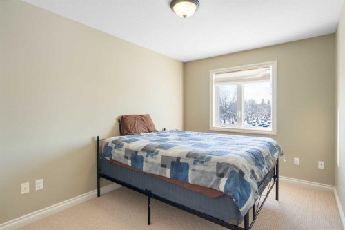 17 Deer Coulee Drive, Didsbury, AB - Indoor Photo Showing Bedroom