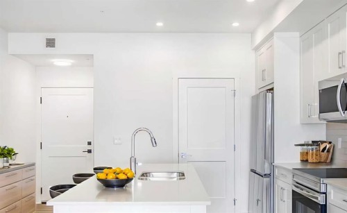 8305-1802 Mahogany Boulevard Se, Calgary, AB - Indoor Photo Showing Kitchen With Double Sink With Upgraded Kitchen