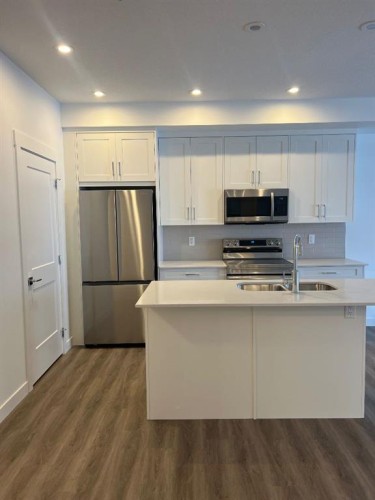 8305-1802 Mahogany Boulevard Se, Calgary, AB - Indoor Photo Showing Kitchen With Stainless Steel Kitchen With Double Sink