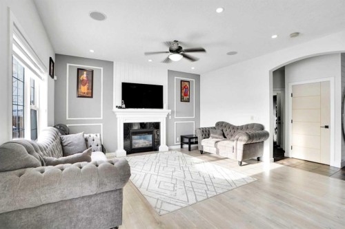 85 Saddlebrook Circle Ne, Calgary, AB - Indoor Photo Showing Living Room With Fireplace