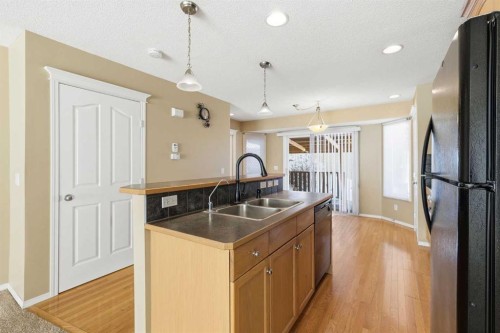 160 Taradale Drive Ne, Calgary, AB - Indoor Photo Showing Kitchen With Double Sink