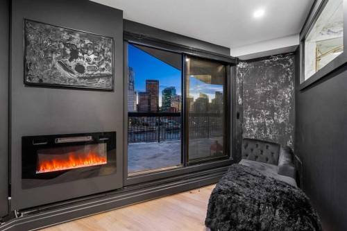 601-320 Meredith Road Ne, Calgary, AB - Indoor Photo Showing Other Room With Fireplace