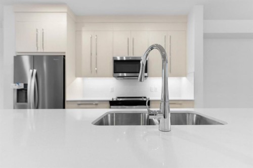 277 Dawson Way, Chestermere, AB - Indoor Photo Showing Kitchen With Double Sink With Upgraded Kitchen