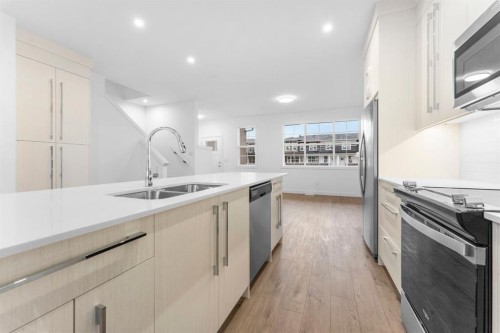 277 Dawson Way, Chestermere, AB - Indoor Photo Showing Kitchen With Double Sink With Upgraded Kitchen