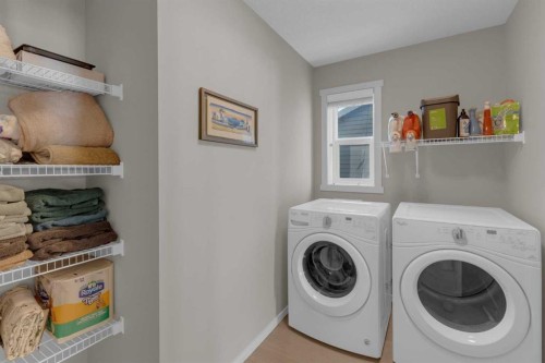 173 Kingsbury Close Se, Airdrie, AB - Indoor Photo Showing Laundry Room