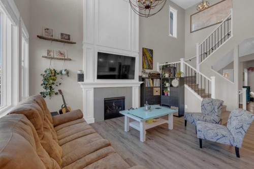 173 Kingsbury Close Se, Airdrie, AB - Indoor Photo Showing Living Room With Fireplace