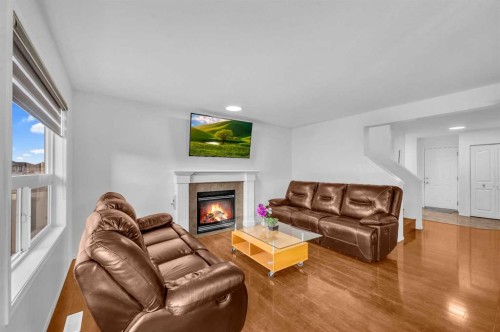 57 Saddlecrest Park Ne, Calgary, AB - Indoor Photo Showing Living Room With Fireplace