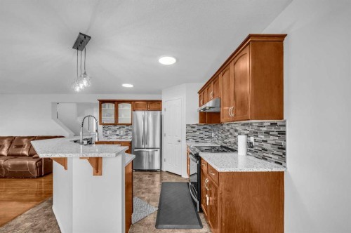 57 Saddlecrest Park Ne, Calgary, AB - Indoor Photo Showing Kitchen With Upgraded Kitchen