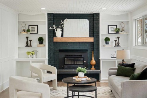 248 Madeira Place Ne, Calgary, AB - Indoor Photo Showing Living Room With Fireplace
