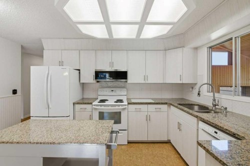 14804 Deer Run Drive Se, Calgary, AB - Indoor Photo Showing Kitchen With Double Sink