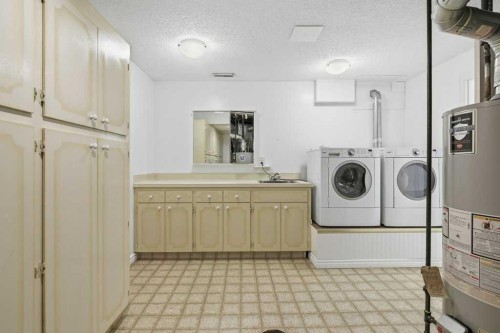 14804 Deer Run Drive Se, Calgary, AB - Indoor Photo Showing Laundry Room