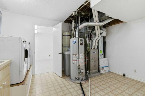 14804 Deer Run Drive Se, Calgary, AB - Indoor Photo Showing Laundry Room
