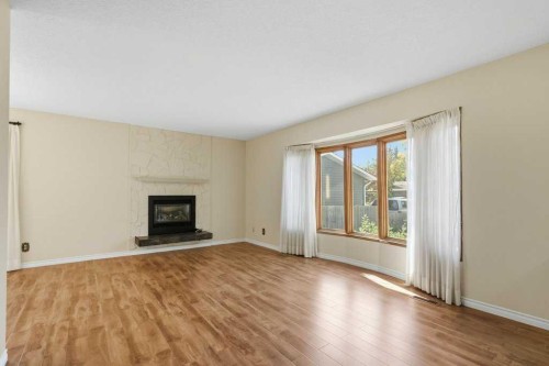 14804 Deer Run Drive Se, Calgary, AB - Indoor Photo Showing Living Room With Fireplace
