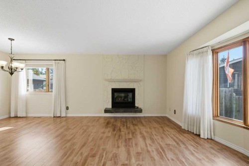 14804 Deer Run Drive Se, Calgary, AB - Indoor Photo Showing Living Room With Fireplace