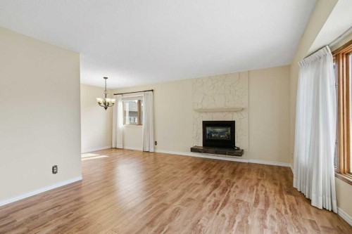 14804 Deer Run Drive Se, Calgary, AB - Indoor Photo Showing Living Room With Fireplace